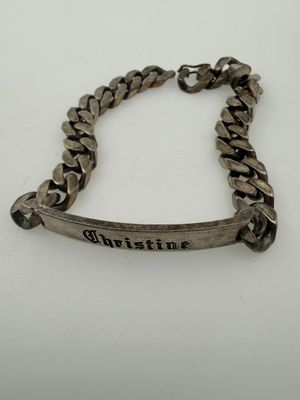 a close up of a bracelet with a name on it