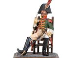 figurine of a soldier sitting on a chair with a cane in his hand