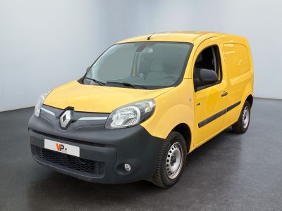the yellow van is parked in a large room with a black floor