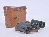 an old pair of binoculars sitting on top of a wooden box