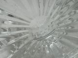 a close up of a clear glass bowl with water in it
