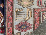 a close up of a rug with a cat laying on it