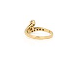 a close up of a gold ring with black diamonds on it