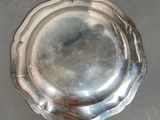 a silver plate that is sitting on a table