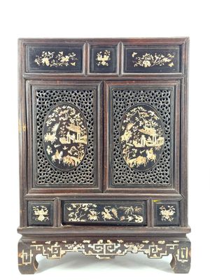 an old wooden cabinet with two doors and two drawers