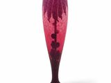 a glass vase with a pink and black design on it