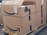 many boxes on a pallet in a warehouse