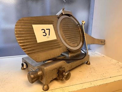 a metal object with a number on it sitting on a shelf