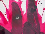 a close up of a painting with red paint on it
