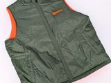 the north face vest in green and orange