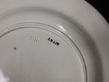 a white plate with a black and white design on it
