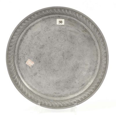 an image of a silver plate with a decorative design on it