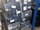 a large stack of boxes sitting on a pallet in a warehouse