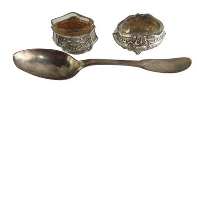 silver spoon and spoon rest with a bowl and spoon on a white background
