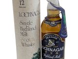 a bottle of scotch whisky next to a cardboard box