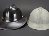 two helmets sitting next to each other on a table