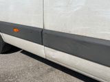 a white van parked on the side of the road