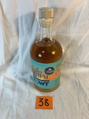 a bottle of liquor sitting on a table with a price tag on it