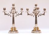 pair of antique silver and gold candelabs on stands