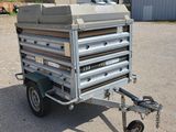 an image of a trailer with a large metal box on the back