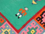 a rug with a picture of a man and a dog on it