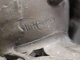 a close up of a metal object with a bird on it