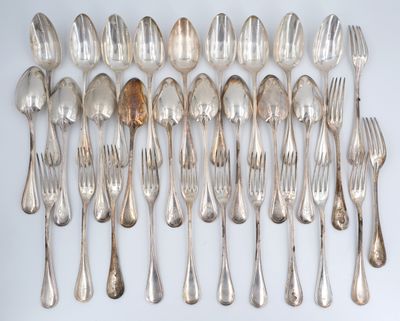a lot of silver spoons and forks on the table
