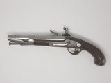 an old gun that is on display on a table