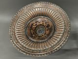 a large metal bowl with a decorative design on it