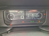 the dashboard of a car with a digital display in the center