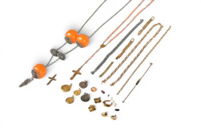 many different necklaces and bracelets on a white surface