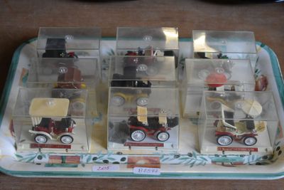 a tray that has a bunch of toy cars in it