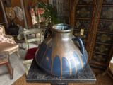 a vase that is sitting on a table in a room
