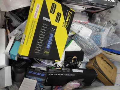 a pile of electronics that is sitting on a table