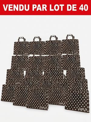 un lot de cinq sacs de courses à pois noirs et blancs