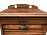 a wooden cabinet with a drawer on top of it