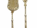 two pieces of silverware on a white background with a spoon and fork