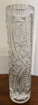 a glass vase that is sitting on a table