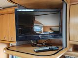 a television that is sitting on top of a cabinet