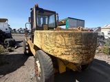 an image of a tractor that is parked on the side of the road