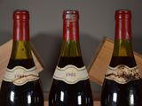 three bottles of wine that are sitting on a table