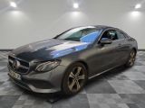 mercedes s - class coupe in a showroom with a checkered floor