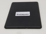 the back of a black tablet with a bar code on it