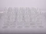 a lot of empty wine glasses sitting on a table