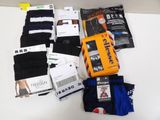 several pairs of men ' s socks and socks are laid out on a table