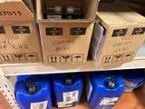 several boxes and containers on a shelf in a store