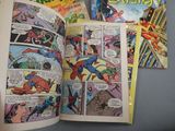 spider - man comics are spread out on a table in a comic book