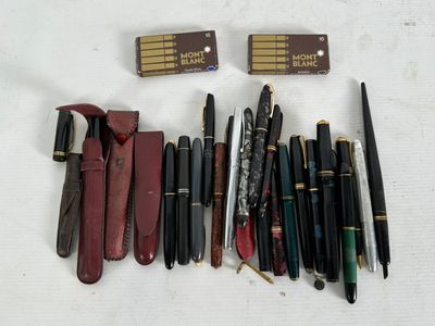 a lot of pens and a pen case on the table