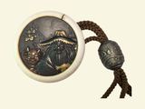 a picture of a necklace with a picture of a pirate on it