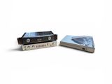 two cassette players sitting next to each other on a white surface